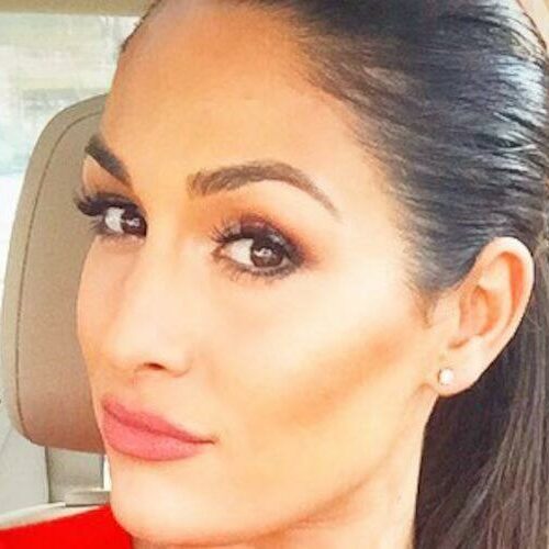 Nikki Bella’s Sunset Sip in a Pink Bikini Has Astrology Experts Wondering: Is She Channeling Venus or Just Showing Off?