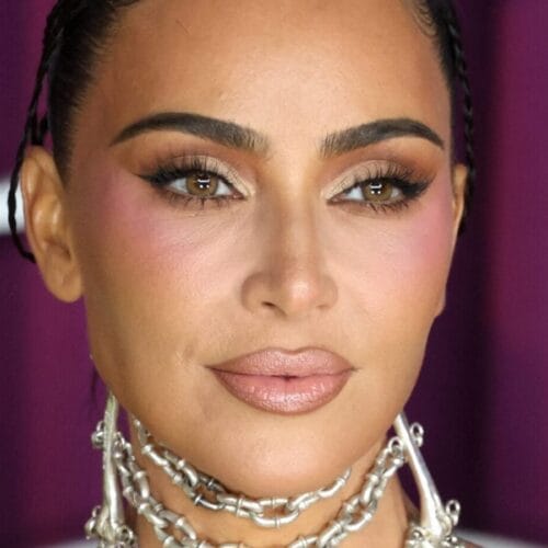 "Kim Kardashian's Cheeky Beach Moment: What This Daring Look Reveals About Her Bold New Era!"