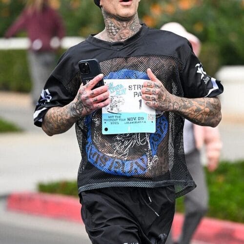 "Travis Barker Spills the Beans: The Secret to Keeping Normalcy Amidst Kourtney Kardashian's Star-Studded Chaos!"