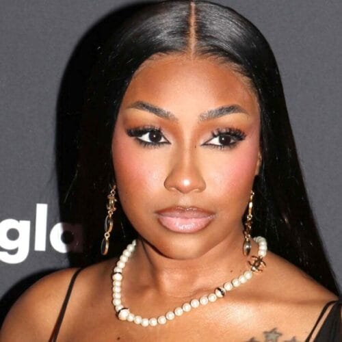 "Yung Miami Shocks Fans in a Plunging Sheer Dress&mdash;Is She Channeling a Whole New Vibe?"